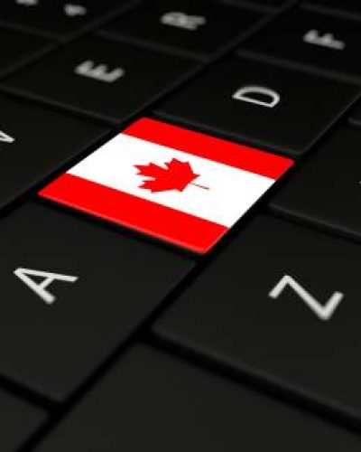 3D rendering close up of Canada flag button on laptop keyboard.