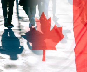 The National Flag of Canada and shadows of people, concept picture