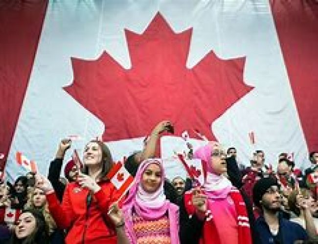 People holding the canadian flag
