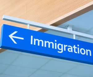 Immigration sign in airport. Airport inscription pointer. Immigration concept photo. Passport control sign with arrow pointer. Official service signpost. Immigration issue banner template