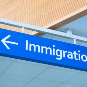 Immigration sign in airport. Airport inscription pointer. Immigration concept photo. Passport control sign with arrow pointer. Official service signpost. Immigration issue banner template