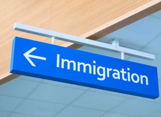 Immigration sign in airport. Airport inscription pointer. Immigration concept photo. Passport control sign with arrow pointer. Official service signpost. Immigration issue banner template