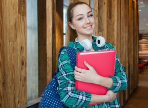 Photo by Anastasiya Gepp on <a href="https://www.pexels.com/photo/woman-standing-in-hallway-while-holding-book-1462630/" rel="nofollow">Pexels.com</a>