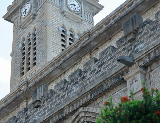 clock tower of historic stone church building