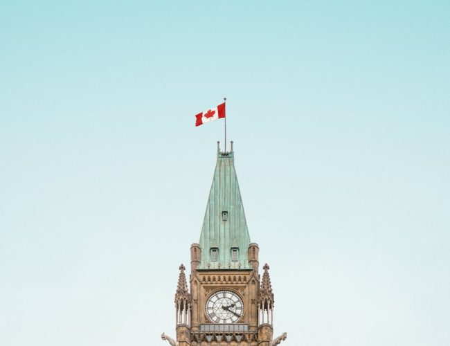 brown and white concrete building under blue sky
