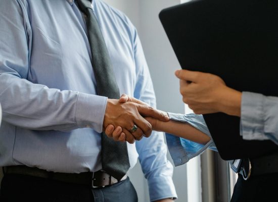 Photo by Sora Shimazaki on <a href="https://www.pexels.com/photo/man-and-woman-shaking-hands-in-office-5668842/" rel="nofollow">Pexels.com</a>